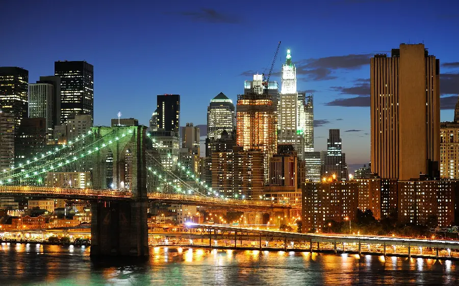 Photo of the famous Brooklyn Bridge with central New York buildings 