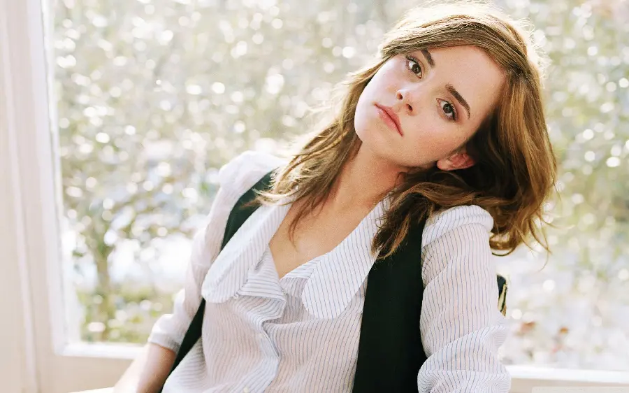 Beautiful photo of Emma Watson with brown hair and a white shirt