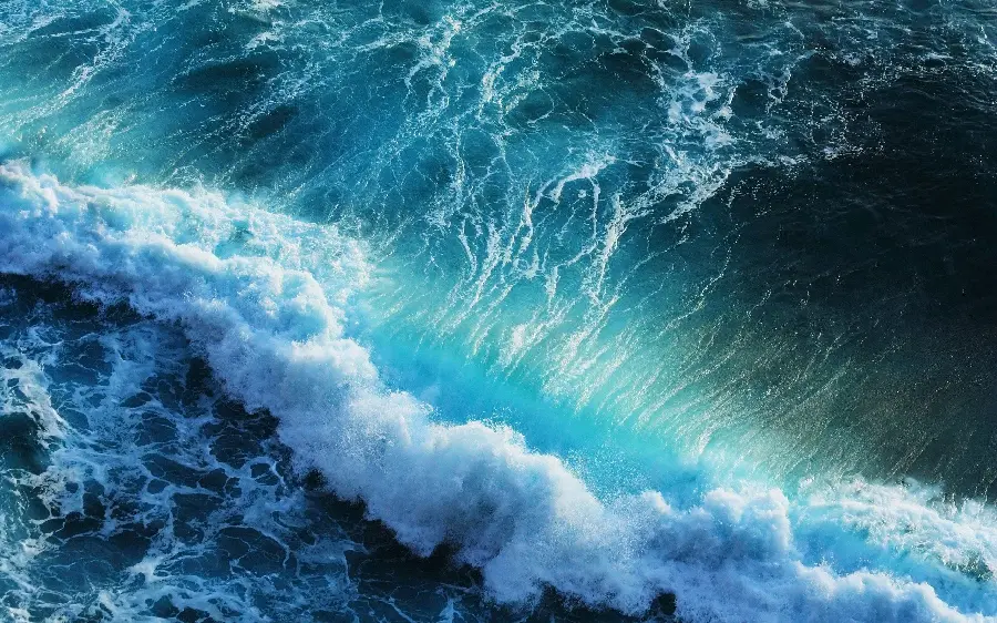 Download a super bright image of blue-green ocean waves in HD quality