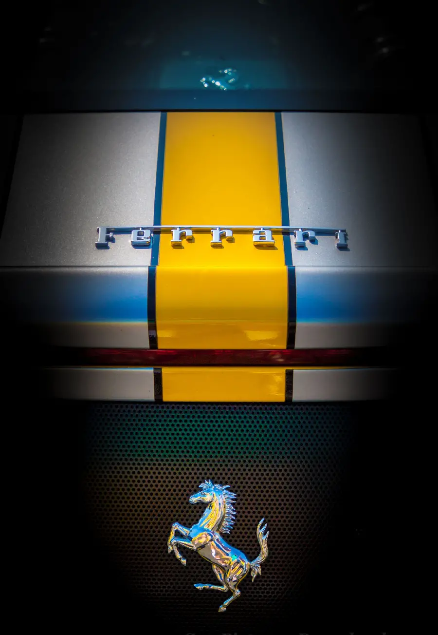Download the image of the Ferrari logo of the Iron Rogue Horse with a blue and yellow theme suitable for profiles and posts