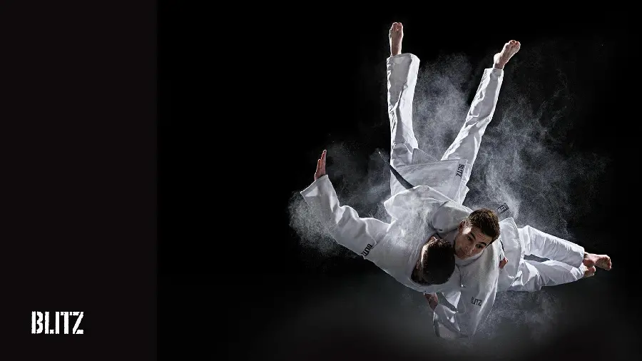 Photo of a karate fight between two people in special clothes for printing on a large banner