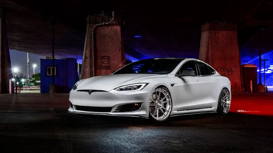 Wallpaper of a Tesla car with stylish rims