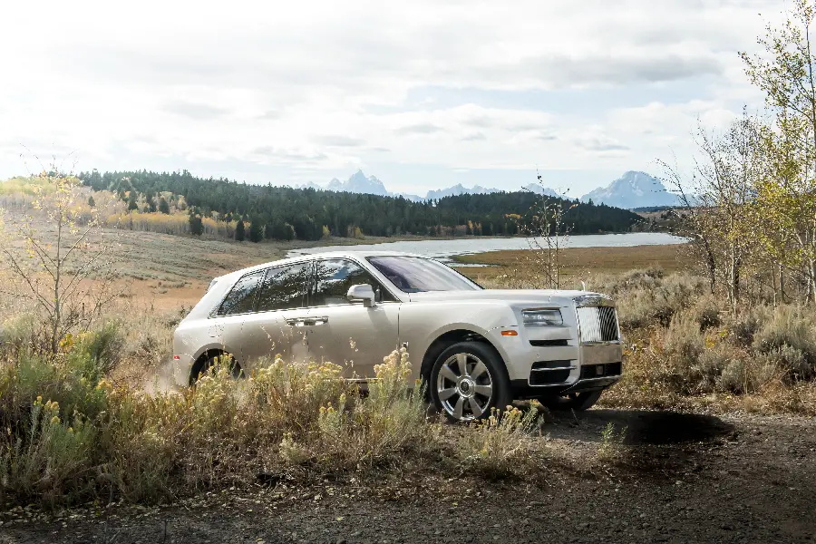 Photo of white Rolls Royce car for wallpaper and background