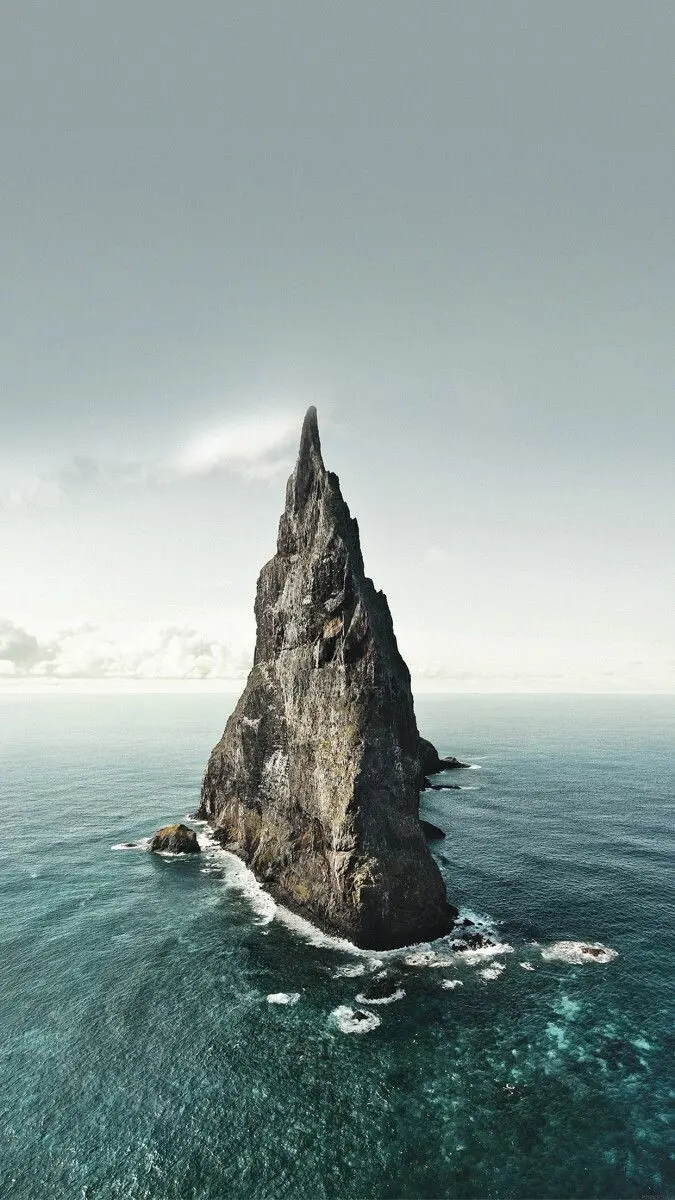 Download iOS 16 Wallpaper Full HD with Lonely Mountain in the Ocean
