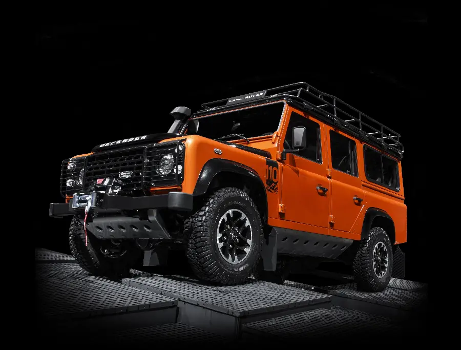 Download a beautiful and cool Land Rover car photo in red with a black background