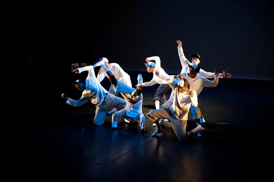 Group photo and dance practice with white clothes and black background