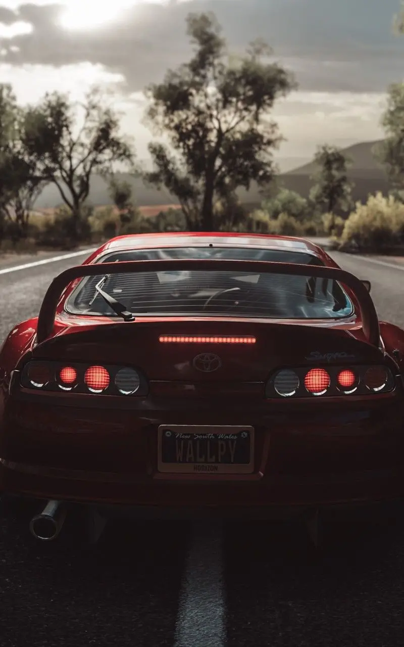 Download Red Japanese Toyota Supra Car Wallpaper from Behind with Lights on