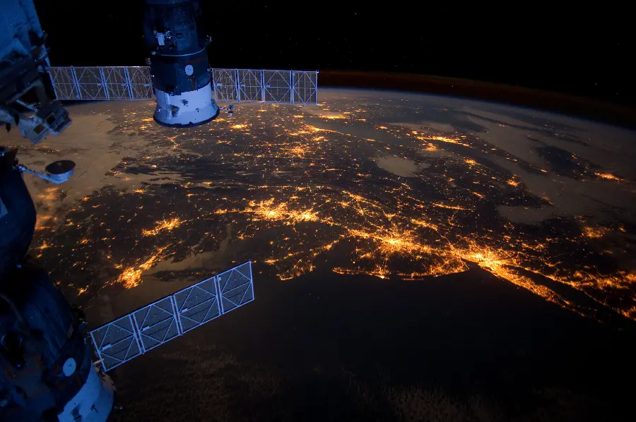 Real photo of the Earth with real fiery lights with a spacecraft from NASA