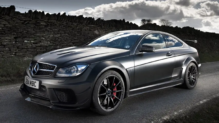 Black and shiny Mercedes AMG E63 in the cloudy desert