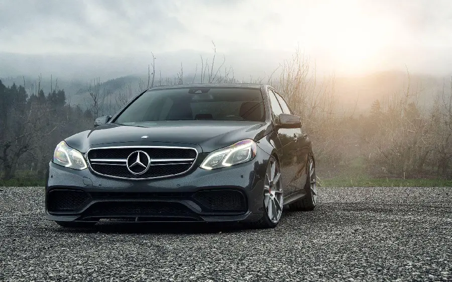 Black Mercedes-Benz AMG E63 HD Wallpaper on the Stone Road
