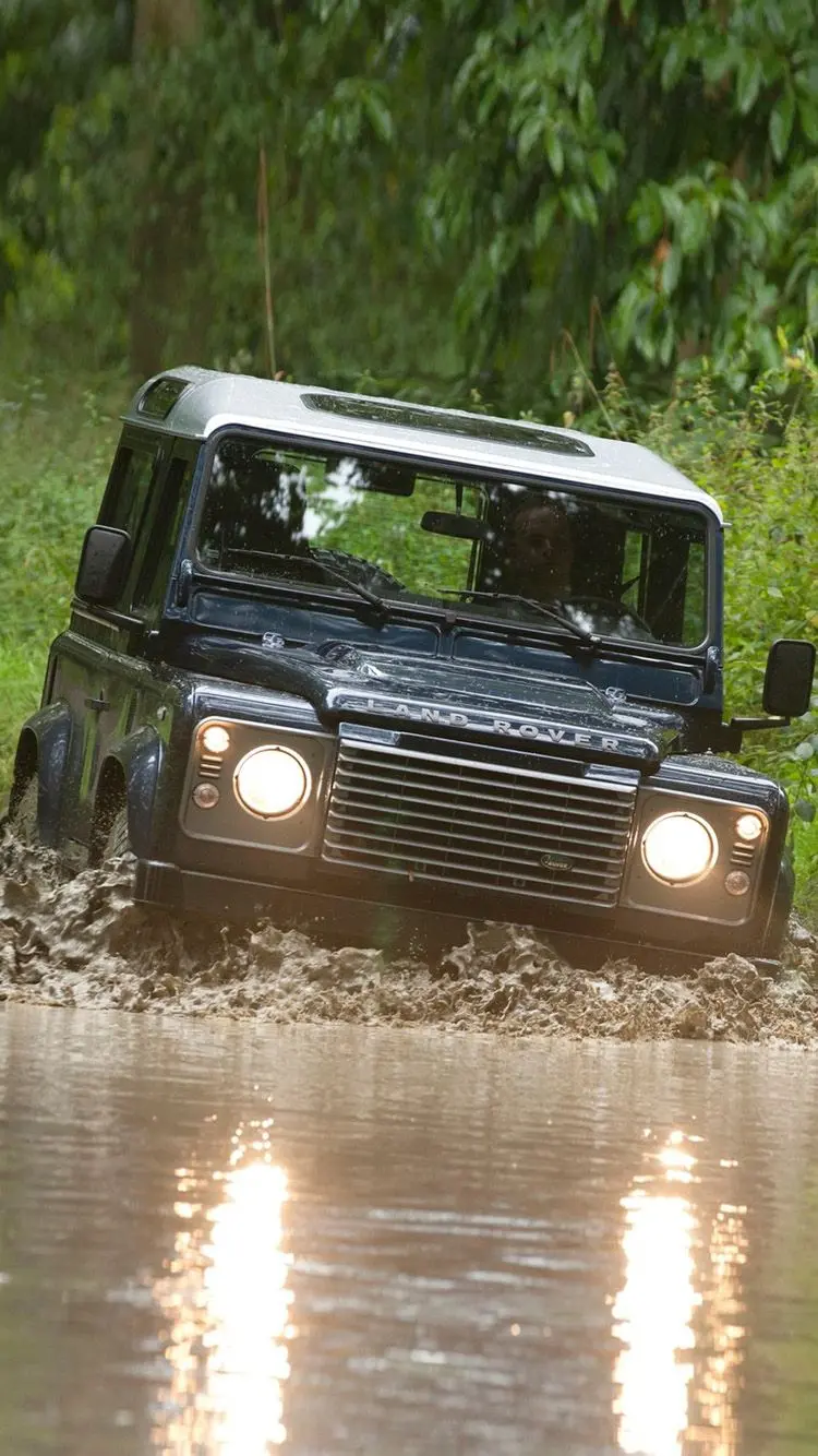 High quality photo of Land Rover Pazhen on a road full of mud and water