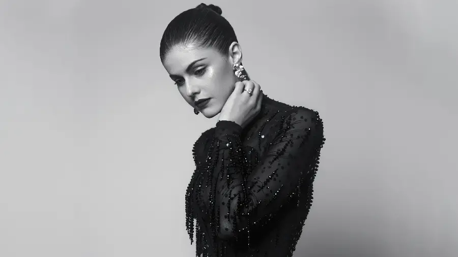 Alexandra Daddario Background with a black outfit and dress