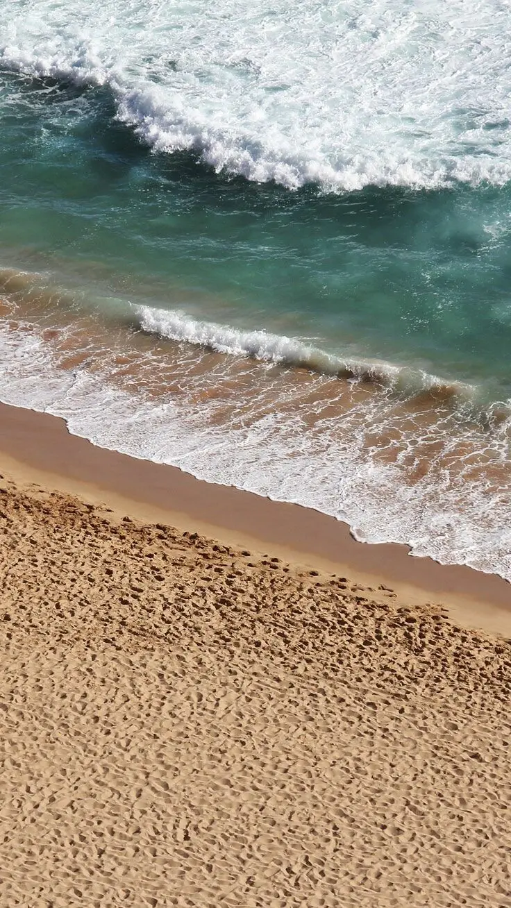 Background and wallpaper for iPhone 10 Apple iPhone XR with a beach and sand and water wave design
