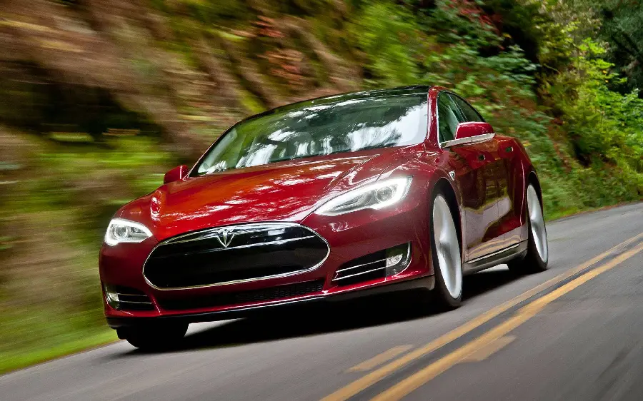 Attractive photo of a shiny and red Tesla