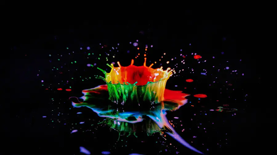 Beautiful wallpaper of a colored drop falling into various colors