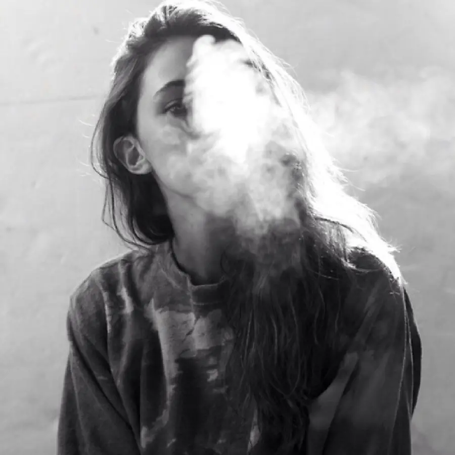 Black and white image of a girl with cigarette smoke and no face for social media profiles