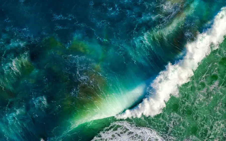 A pleasant ocean wallpaper with a green and blue theme for laptops and computers