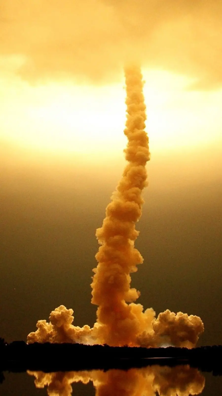Download a beautiful photo of a missile disappearing behind the clouds for your mobile wallpaper in Full HD quality