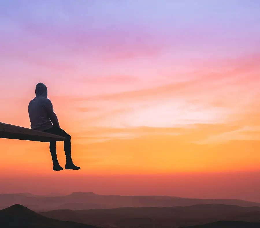 Wallpaper of a thoughtful and loving man at sunset for phones and computers