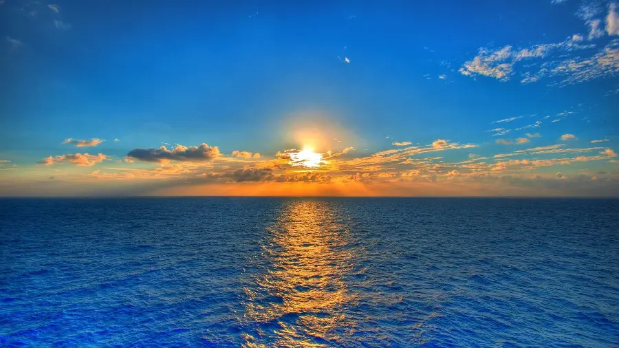 A dreamy image of the ocean at sunset in 8k quality