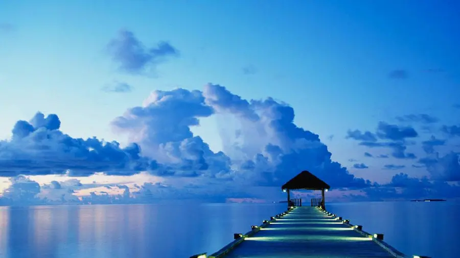 Image Magical background of a wooden bridge in the middle of a beautiful blue ocean for desktop