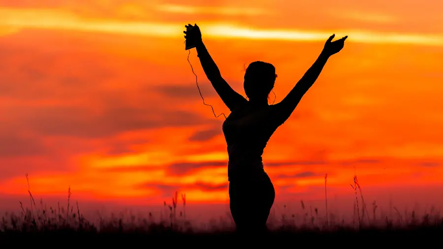 Profile photo of a sunset and a beautiful girl listening to music