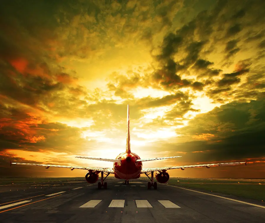 Download artistic image of a plane from behind in a cloudy sky for Windows 11 wallpaper