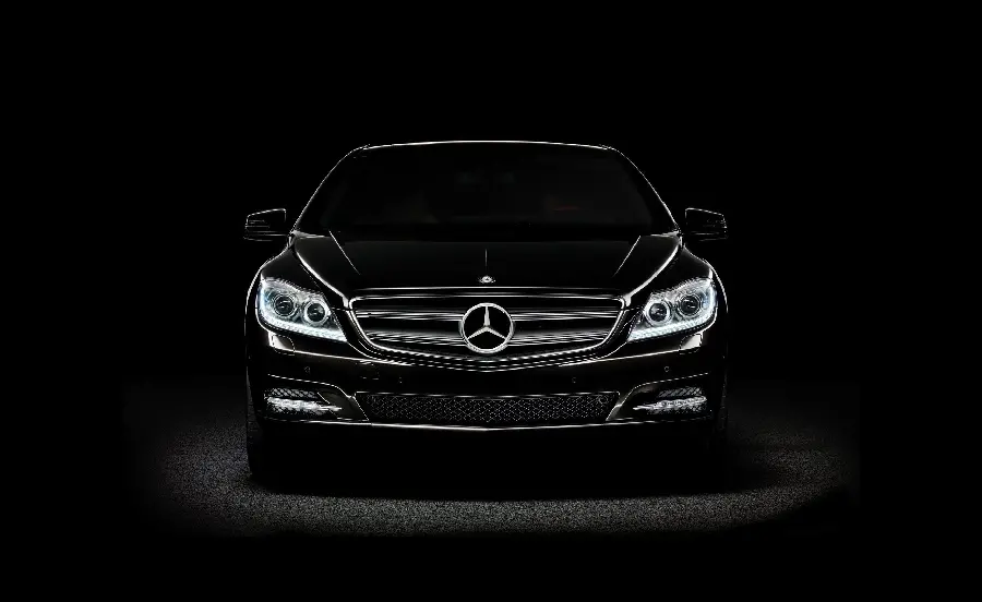 Wallpaper of Mercedes-Benz logo on black car in black frame