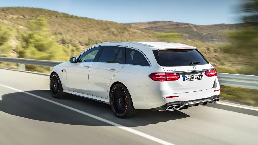 High Quality Photo of White Mercedes AMG E63 on the Road