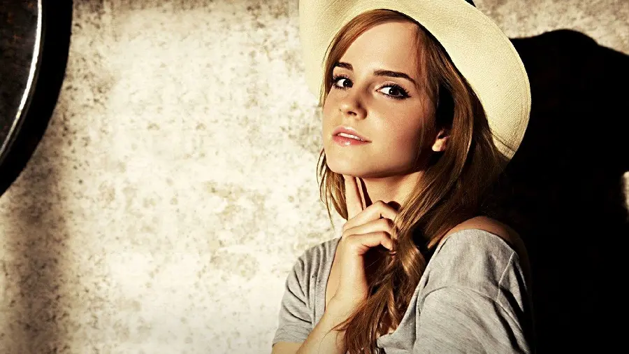 Wallpaper of Emma Watson with a hat and a gray dress