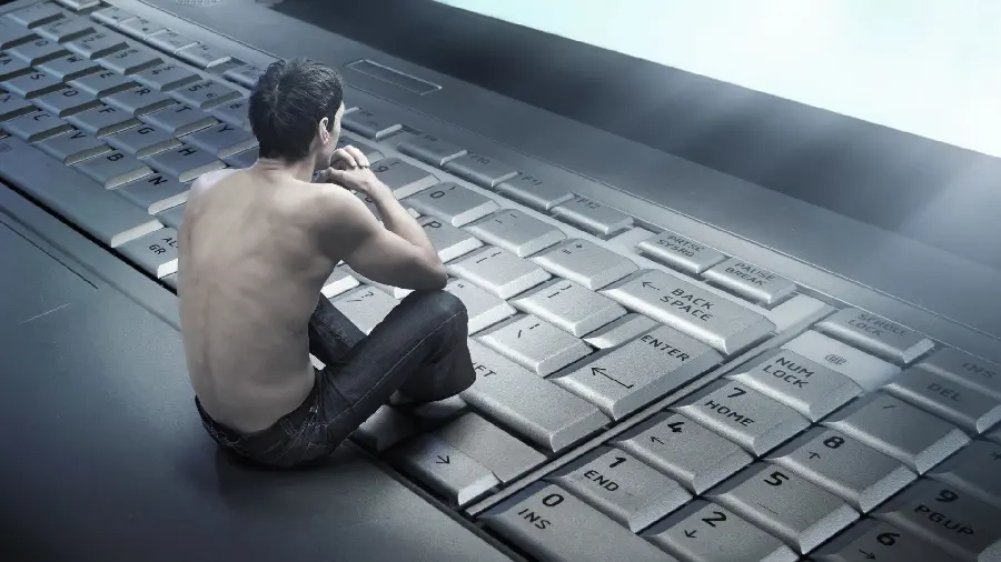 Special artistic profile photo of a man thinking next to a keyboard