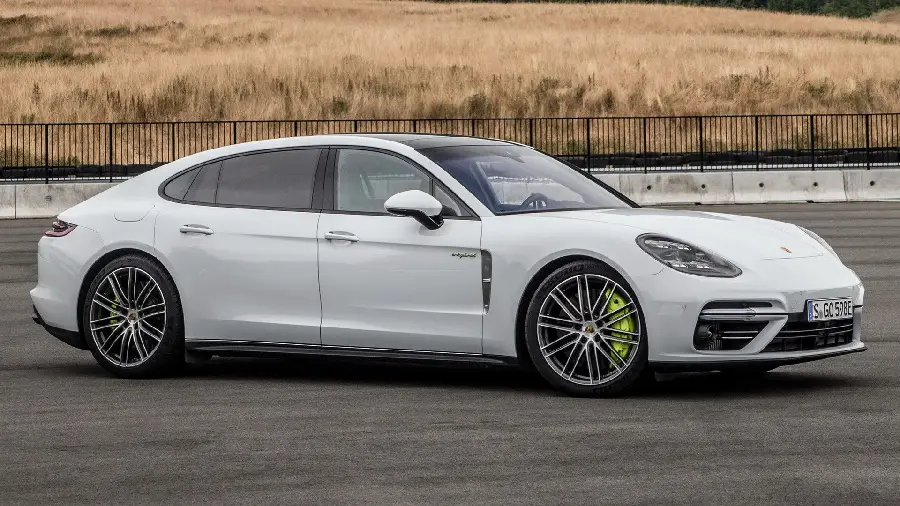 Photo of the white Porsche Panamera on the road and from the side view