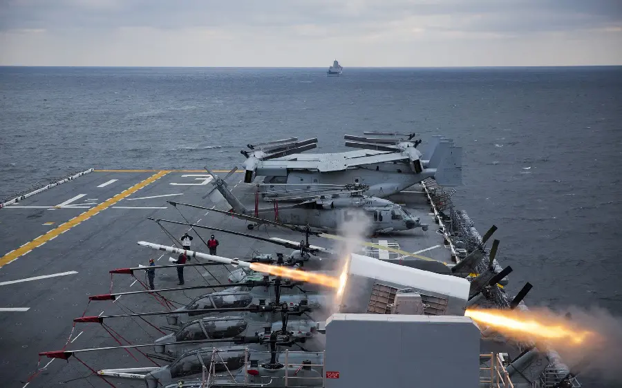 Download a spectacular image of a missile being launched from the surface of a ship with military equipment suitable for computer and laptop backgrounds