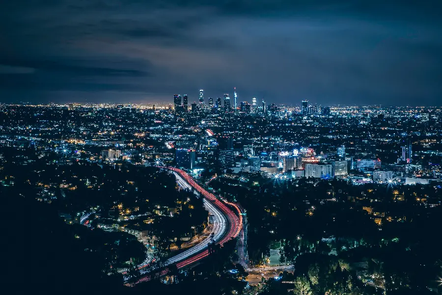 Photo of the city of Los Angeles with a highway in the foreground and a downtown in the background
