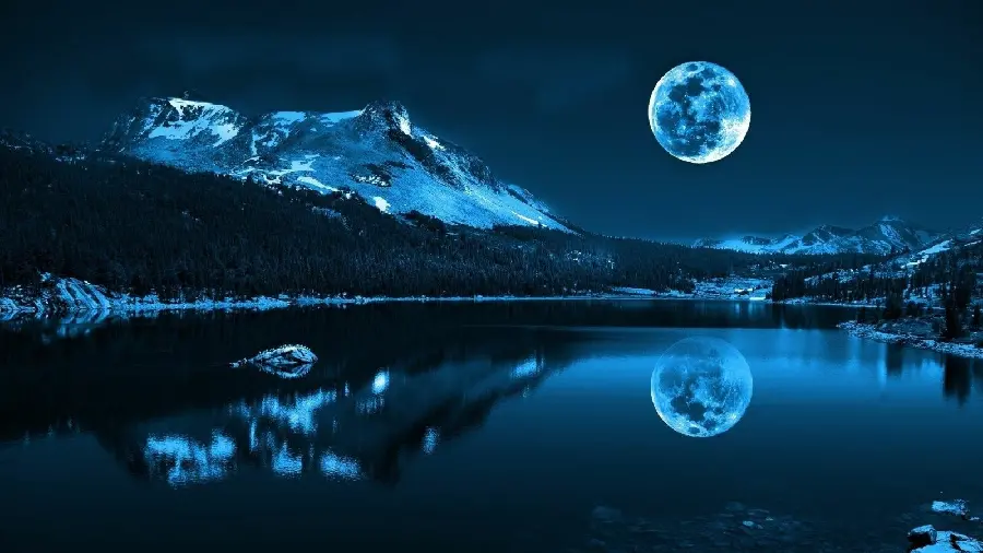 A Great Photo of the Mountains at Night with a Full and Bright Moon