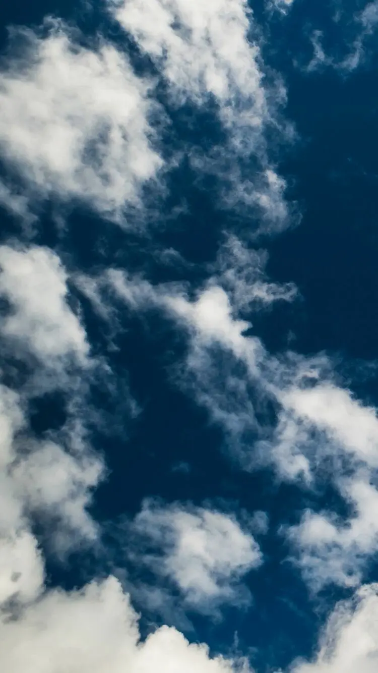 Blue sky and various white clouds background for iPhone and Apple smartphones