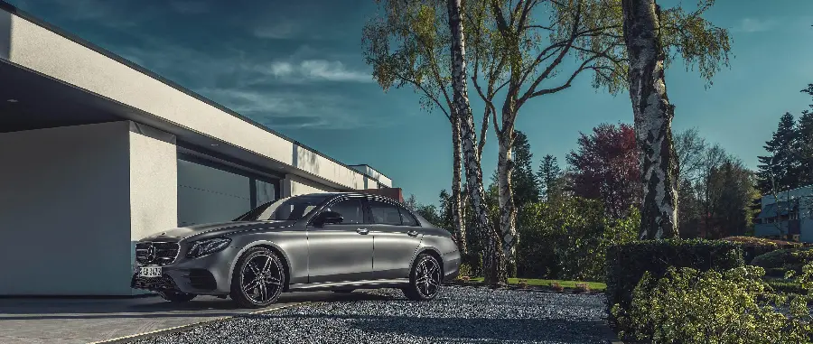 High quality background image of Mercedes Benz E300 in the treesGreenery