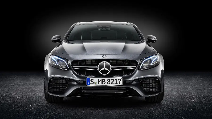 High-quality photo of a silver Mercedes-Benz AMG E63 in the depths of darkness