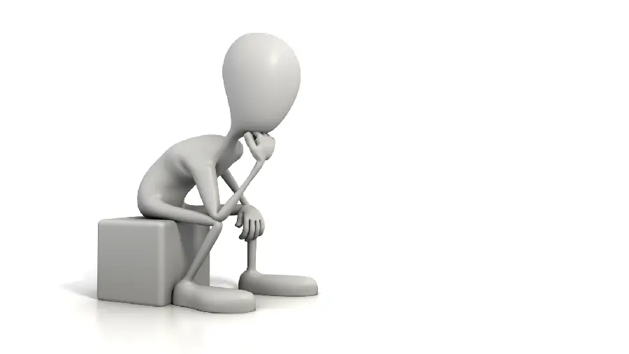 Photo of a thinking man thinking isolated on a white background