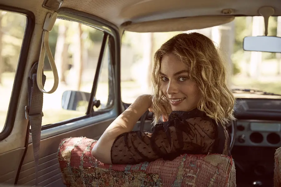 Margot Robbie's naughty and smiling photo in the car in high quality