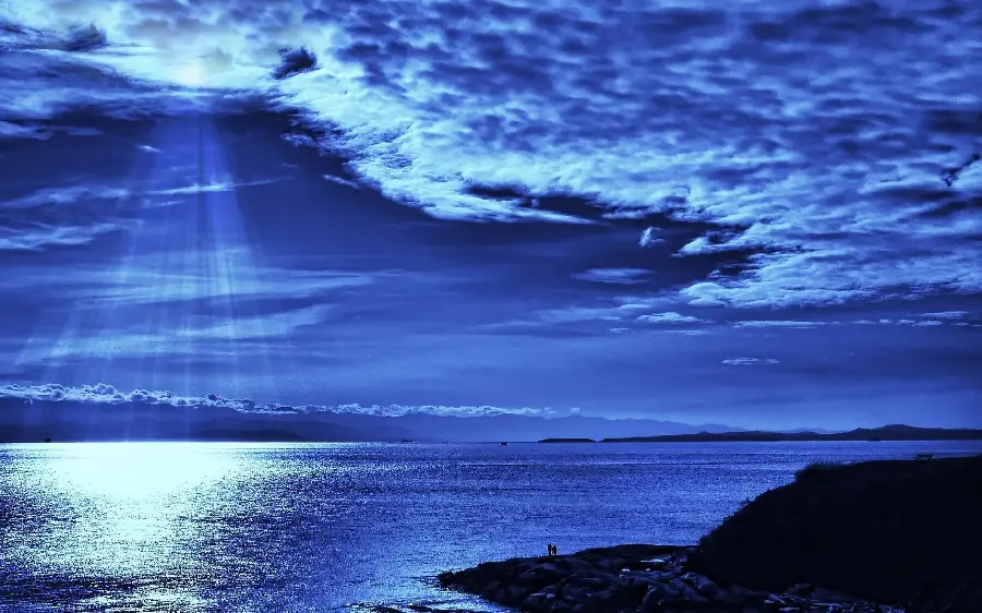 Download a beautiful image of ocean waves at night under the glare of the moonlight Moon with a blue theme for wallpapers and Instagram profiles and posts
