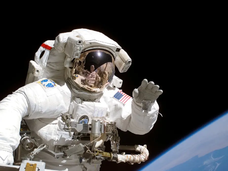 Photo of NASA astronaut in a special American-made suit in white