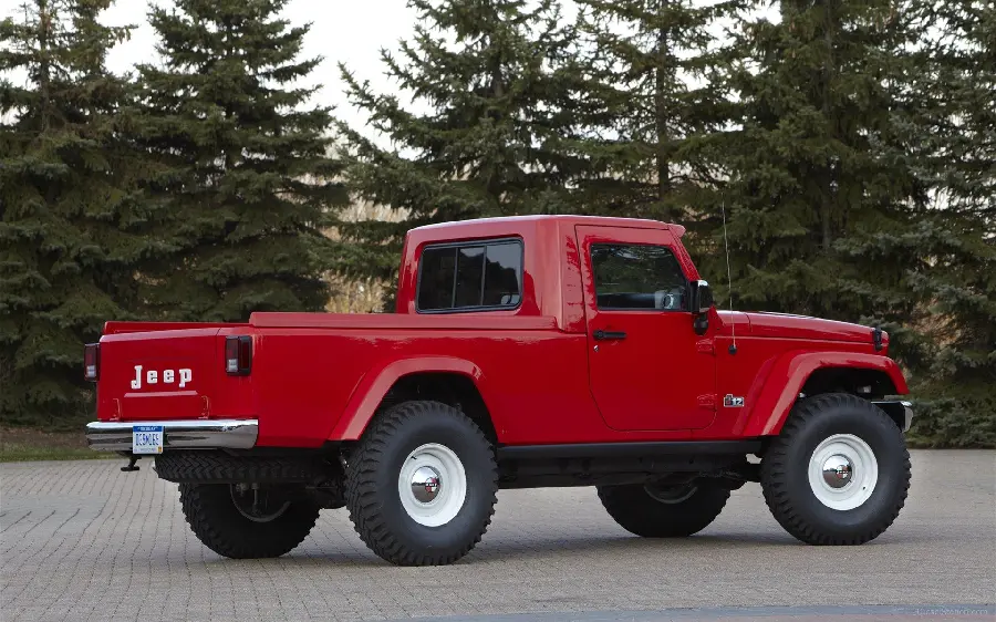 A spectacular image of a red jeep in the middle of a beautiful road for your profile