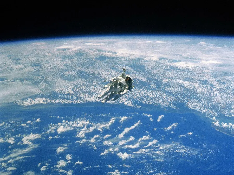 Photo of astronauts above the real planet from NASA organization with high quality