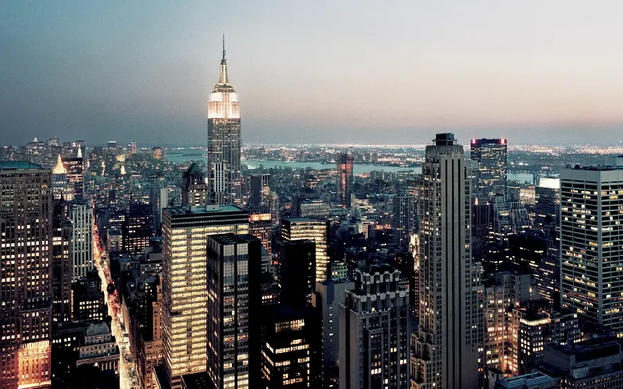 New York City background and wallpaper at night with long and busy streets