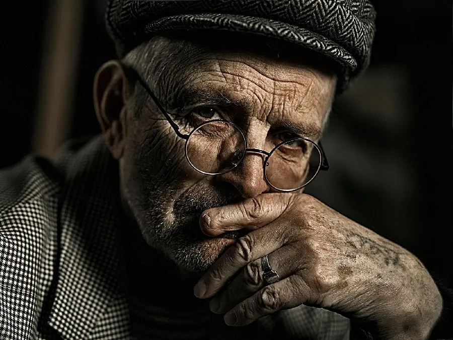 Photo of an old man thinking and contemplating for profile and background