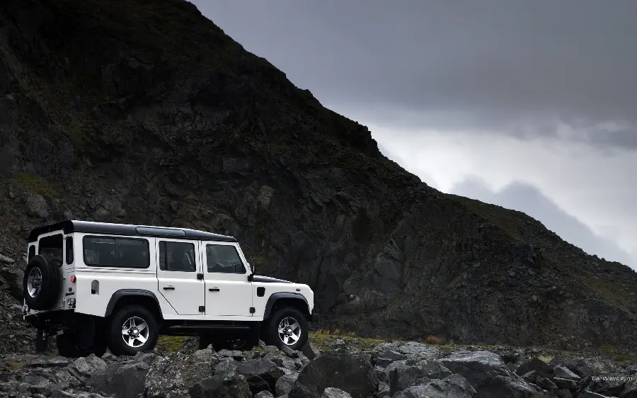 Photo of white and four-door Land Rover Defender SUV