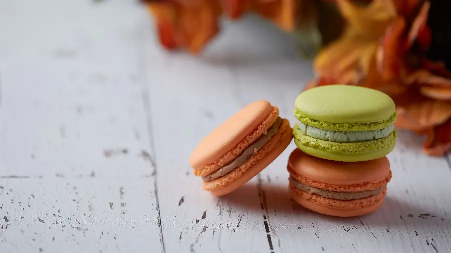 Beautiful and attractive photo of macaron sweets in brown and green