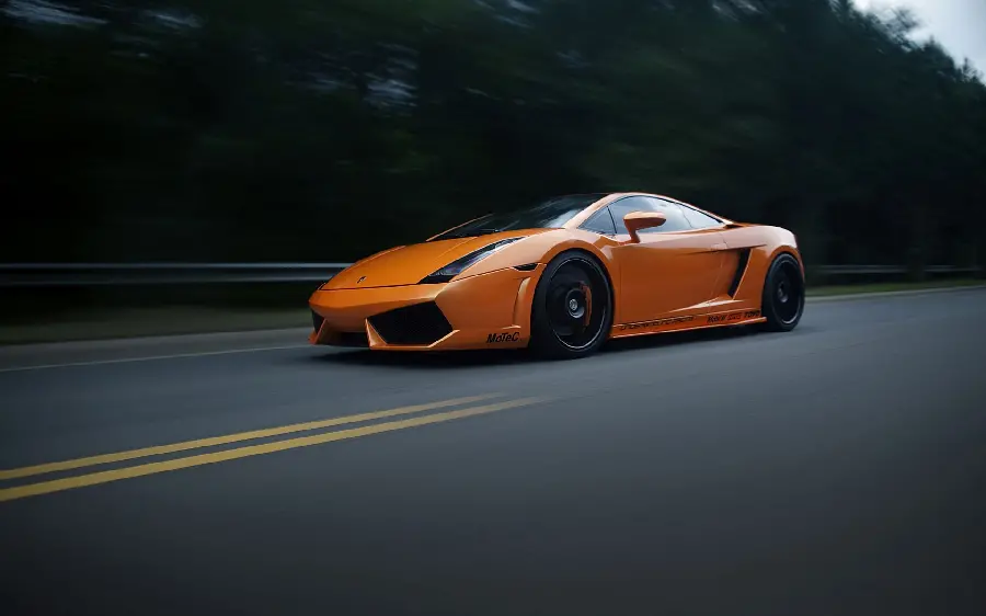 Download the incredibly beautiful photo of the orange Lamborghini Murcielago on the road at high speed for your computer and laptop profile and wallpaper