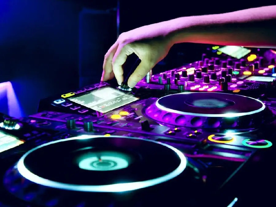 High-quality photo of DJ DJ adjusting and mixing the song and purple light